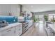 Modern kitchen with stainless steel appliances, white cabinets, stylish backsplash, and marble countertops at 3305 Fernbird Ln, North Las Vegas, NV 89084