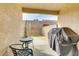 Backyard patio featuring black table, chairs, and a grill, all set in a private space at 3425 Conan St # 103, Las Vegas, NV 89129