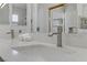 Bathroom featuring double sinks, a sleek mirror, and white countertops at 3425 Conan St # 103, Las Vegas, NV 89129