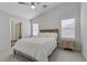 Cozy bedroom featuring plush carpeting, plantation shutters, and a ceiling fan at 3425 Conan St # 103, Las Vegas, NV 89129