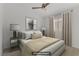Staged bedroom with neutral tones, bedside tables, lamps, and an area rug at 3425 Conan St # 103, Las Vegas, NV 89129
