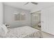 Bright bedroom with a large mirrored closet and a ceiling fan at 3425 Conan St # 103, Las Vegas, NV 89129