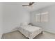 Bedroom with ceiling fan, carpeting, and a window with plantation shutters at 3425 Conan St # 103, Las Vegas, NV 89129