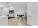 Bright dining area with modern table set, light gray sofa, and neutral tile floors at 3425 Conan St # 103, Las Vegas, NV 89129