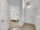 Inviting foyer showcasing the front door, tile flooring, and a glimpse into the bedroom at 3425 Conan St # 103, Las Vegas, NV 89129