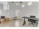 Home office with high ceiling, tile floors, with modern black desk and chair at 3425 Conan St # 103, Las Vegas, NV 89129