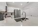 Well-lit kitchen featuring stainless steel appliances, white cabinetry and countertops at 3425 Conan St # 103, Las Vegas, NV 89129