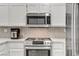 Bright kitchen featuring modern stainless steel appliances and white cabinetry at 3425 Conan St # 103, Las Vegas, NV 89129