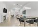 Bright living room featuring fireplace, tile flooring, high ceilings, and modern furniture at 3425 Conan St # 103, Las Vegas, NV 89129