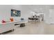Open concept living room and kitchen area showcasing modern design and natural light at 3425 Conan St # 103, Las Vegas, NV 89129