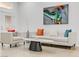 Living room featuring modern furniture, bright white walls, and stylish decor at 3425 Conan St # 103, Las Vegas, NV 89129