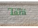 Stone wall displays the community name, Villas at Tara, in green lettering at 3425 Conan St # 103, Las Vegas, NV 89129