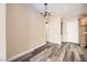 Dining room featuring wood floors, a modern chandelier, and an open layout at 4052 Rocky Beach Dr, Las Vegas, NV 89115