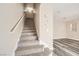 Carpeted staircase leading to the upper level of the home at 4052 Rocky Beach Dr, Las Vegas, NV 89115