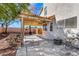 Covered back patio features ample space for dining and lounging, perfect for outdoor relaxation at 409 Rutherford Cir, Las Vegas, NV 89123