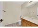 Bathroom featuring a light-colored vanity with sink, neutral walls, and tile flooring at 409 Rutherford Cir, Las Vegas, NV 89123