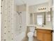 Bathroom with tub and shower combination, sink and vanity with tiled floors at 409 Rutherford Cir, Las Vegas, NV 89123