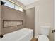 Bathroom showing the tub/shower with contemporary tiled walls and shower fixture at 409 Rutherford Cir, Las Vegas, NV 89123