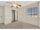 Bedroom featuring neutral carpet, mirrored closet and natural light at 409 Rutherford Cir, Las Vegas, NV 89123