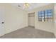 Bedroom featuring neutral carpet, standard closet, ceiling fan and natural light at 409 Rutherford Cir, Las Vegas, NV 89123