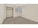 Bedroom has a large window, carpet flooring, and a standard closet at 409 Rutherford Cir, Las Vegas, NV 89123