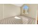 A cozy room with tile floors, a big arched window that provides natural light, and neutral walls at 409 Rutherford Cir, Las Vegas, NV 89123
