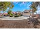 Charming home with well-maintained landscaping and a spacious driveway at 409 Rutherford Cir, Las Vegas, NV 89123