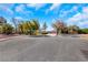 Street view of a home with desert landscaping at 409 Rutherford Cir, Las Vegas, NV 89123