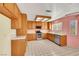 View of kitchen featuring tile flooring, stainless steel appliances, and ample wood cabinetry at 409 Rutherford Cir, Las Vegas, NV 89123