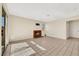 Bright living room with a brick fireplace, tile flooring, and sliding glass doors to the backyard at 409 Rutherford Cir, Las Vegas, NV 89123