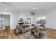 Inviting living room featuring wood floors, a ceiling fan and stylish furniture with great natural light at 4385 Bramblewood St, Las Vegas, NV 89147