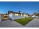 Back of house at dusk showcasing the freshly laid lawn at 4667 E Boston Ave, Las Vegas, NV 89104