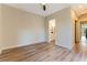 Inviting bedroom featuring wood floors and an ensuite bathroom at 4796 Riva De Romanza St, Las Vegas, NV 89135