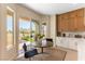 Cozy breakfast nook with a round table, chairs, and sliding glass doors to the outdoor area at 4796 Riva De Romanza St, Las Vegas, NV 89135