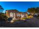 Stunning exterior view showcases the home's architectural details and the inviting outdoor living spaces at 4796 Riva De Romanza St, Las Vegas, NV 89135