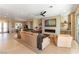 Open concept living room with fireplace, entertainment center, and neutral paint at 4796 Riva De Romanza St, Las Vegas, NV 89135