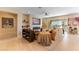 Comfortable living room featuring tile floors, a fireplace, and sliding doors to the backyard at 4796 Riva De Romanza St, Las Vegas, NV 89135