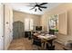 Bright office space with shutters, a large desk, and plenty of natural light at 4796 Riva De Romanza St, Las Vegas, NV 89135
