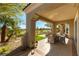 Covered patio with tile flooring, views of the golf course, and outdoor kitchen at 4796 Riva De Romanza St, Las Vegas, NV 89135