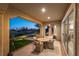 Covered patio with seating area and view of the putting green at 4796 Riva De Romanza St, Las Vegas, NV 89135