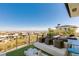 Comfortable outdoor seating on a balcony with city and mountain views at 4918 Summit Overlook Dr, Las Vegas, NV 89135