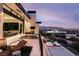 Enjoy outdoor living with views from this property's multiple seating areas and a sleek pool at 4918 Summit Overlook Dr, Las Vegas, NV 89135