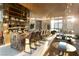 Home wet bar with stylish seating and open shelves, enhanced by natural light and design at 4918 Summit Overlook Dr, Las Vegas, NV 89135
