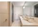 Bright bathroom featuring large mirrors, modern vanity, and a glass-enclosed shower at 4918 Summit Overlook Dr, Las Vegas, NV 89135