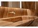 Close-up of luxurious primary bathroom featuring marble countertops and gold fixtures at 4918 Summit Overlook Dr, Las Vegas, NV 89135