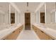 Modern bathroom featuring dual vanities, sleek countertops, and a glass-enclosed shower at 4918 Summit Overlook Dr, Las Vegas, NV 89135