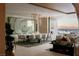 Elegant dining room featuring modern chandelier, large art piece, and access to outdoor living area at 4918 Summit Overlook Dr, Las Vegas, NV 89135