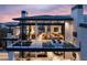Elevated home exterior with terraces, outdoor lounge areas, and expansive views at 4918 Summit Overlook Dr, Las Vegas, NV 89135