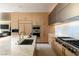 Contemporary kitchen with a large island, stainless steel appliances, and custom cabinetry at 4918 Summit Overlook Dr, Las Vegas, NV 89135