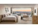 Spacious bedroom with mountain views, modern furnishings, and a calming color palette at 4918 Summit Overlook Dr, Las Vegas, NV 89135